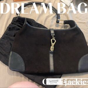 Gucci “Jackie” Vintage Bag.  Brown suede, bamboo handle, and rare crab clasp.